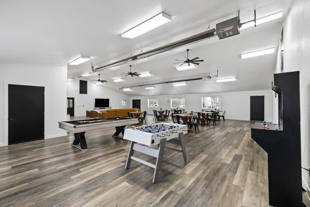 Clubhouse recreation area with pool and air hockey